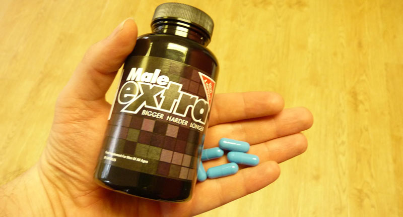 blue pills in hand